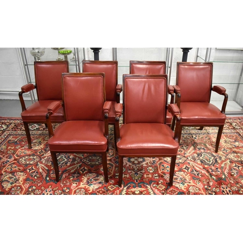 409 - A set of six 20th century teak and red leather armchairs.