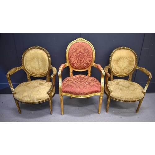 410 - A pair of giltwood salon chairs in the Louis XVIII style, with circular backs and seats, with ribbon... 