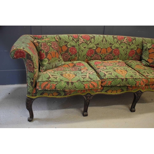 413 - An elegant 19th century mahogany framed sofa of unusually shallow proportions, the finely carved cab... 