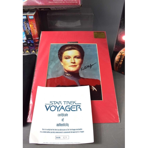 72 - A group of Star Trek Voyager memorabilia to include a limited edition jumper to commemorate the laun... 