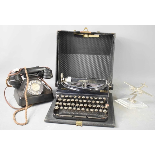 238 - A Vintage Remington typewriter, together with a vintage telephone, later adapted and a desk model of... 