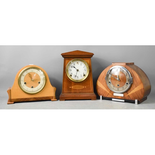 243 - An Art Deco mahgoany mantle clock, with arabic dial and steel hands, bearing presentation plaque to ... 