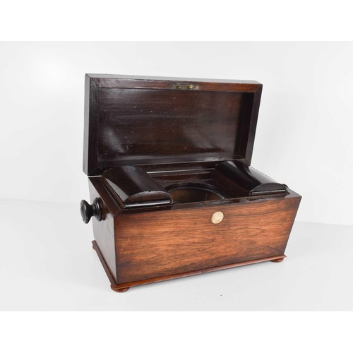 245 - A 19th century rosewood tea caddy, of sarcophagus form, the interior fitted with two lidded compartm... 