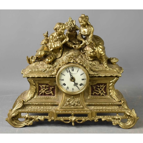 247 - A 20th century French style Imperial brass mantle clock, the Roman Numeral dial surmounted by two yo... 