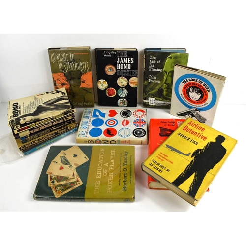 35 - A quantity of vintage hardback and paperback books related to Ian Fleming and James Bond, to include... 