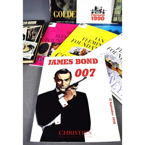 36 - A collection of vintage and retro James Bond ephemera, to include a James Bond luncheon menu card fr... 