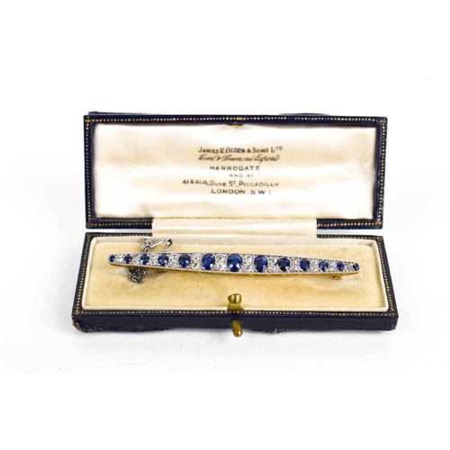 1 - An impressive diamond and cornflower blue sapphire brooch, of marquise form set with thirteen gradua... 