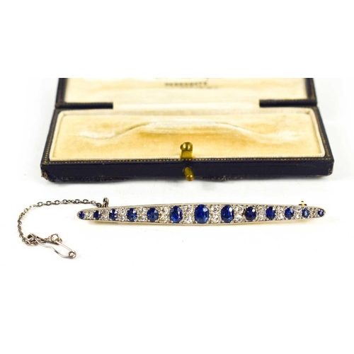 1 - An impressive diamond and cornflower blue sapphire brooch, of marquise form set with thirteen gradua... 