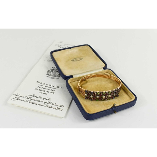 10 - A 19th century gold (tested as 14ct), diamond, pearl and coloured stone set bangle, set in five line... 