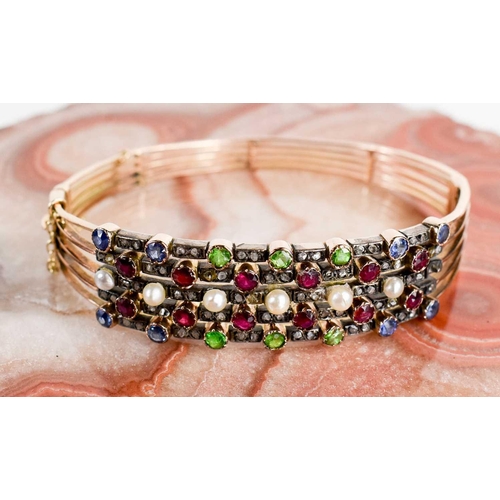 10 - A 19th century gold (tested as 14ct), diamond, pearl and coloured stone set bangle, set in five line... 