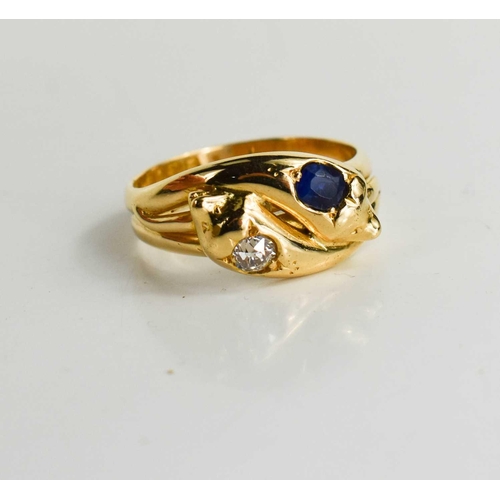 12 - An 18ct gold, sapphire and diamond snake ring, the two snake heads set with an old cut diamond and a... 