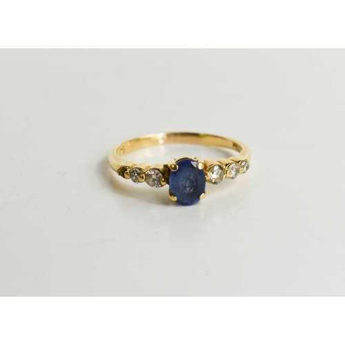 122 - A 14ct gold, diamond and tanzanite seven stone ring, the central oval cut tanzanite of approximately... 