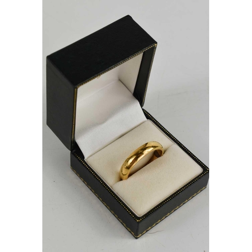 134 - A yellow metal unmarked wedding band, size W, 10.24g.