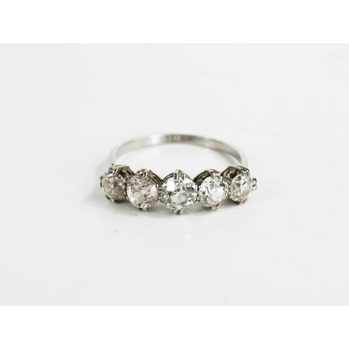 14 - A diamond five stone ring, the largest central stone of approximately 5.4mm, or 0.6ct, size U, 3.92g... 