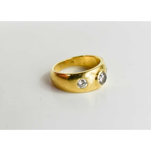 146 - An 18ct gold dress ring set with three graduated diamonds, size J½, the diamonds totalling approxima... 