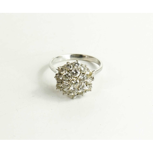 148 - A mid century diamond cluster dress ring, set with nineteen diamond brilliants, size U, 6.33g, diame... 