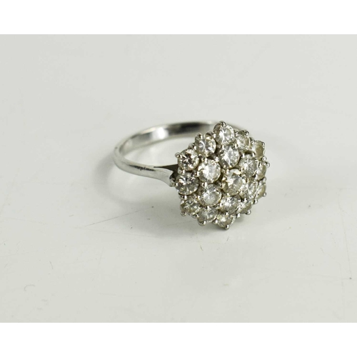 148 - A mid century diamond cluster dress ring, set with nineteen diamond brilliants, size U, 6.33g, diame... 