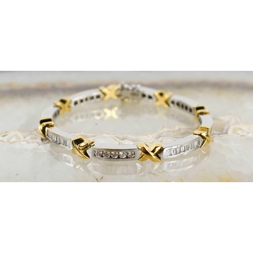 15 - An 18ct white & yellow gold and diamond bracelet, designed as series of eight diamond set white link... 