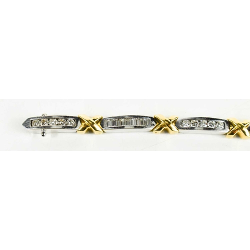 15 - An 18ct white & yellow gold and diamond bracelet, designed as series of eight diamond set white link... 