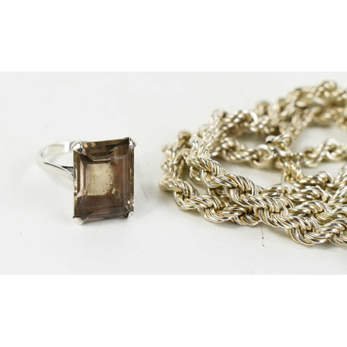 154 - A silver and smokey quartz ring, together with a similar pendant and chain and two silver rope twist... 