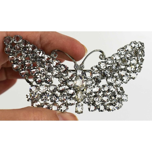 159 - A vintage silvered metal and paste set butterfly form brooch, 8 by 4.5cm, in an antique presentation... 