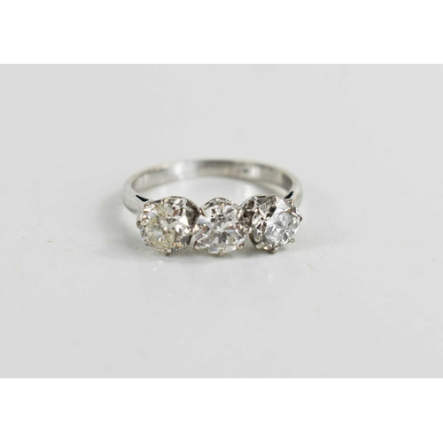 16 - A platinum and three stone diamond ring, the brilliant cut diamonds each approximately 0.65cts, in c... 