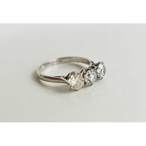 16 - A platinum and three stone diamond ring, the brilliant cut diamonds each approximately 0.65cts, in c... 