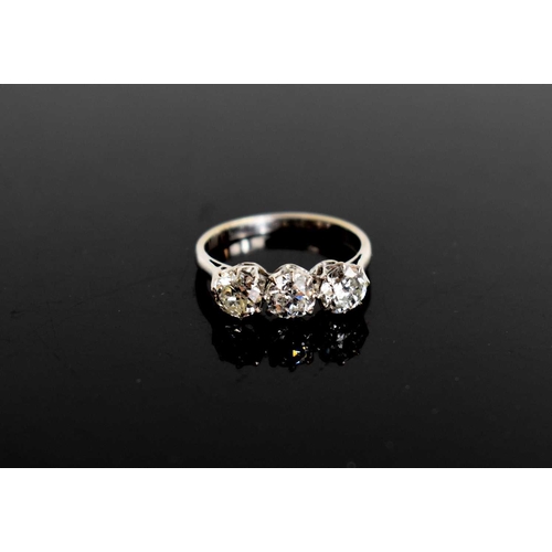 16 - A platinum and three stone diamond ring, the brilliant cut diamonds each approximately 0.65cts, in c... 