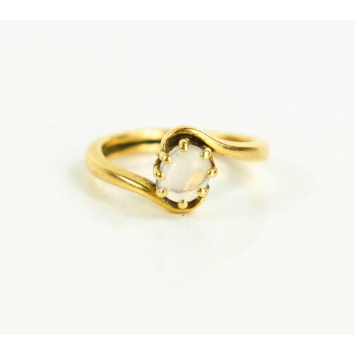 163 - A gold [tested as] and moonstone ring, the oval moonstone in a claw setting, size O, 5g.