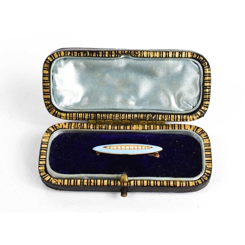 18 - A 14ct gold, turquoise enamel and seed pearl brooch of marquise form, the seed pearls set to the cen... 