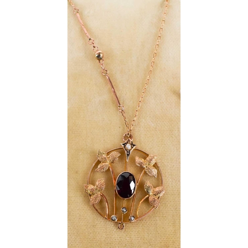 2 - An Art Nouveau period rose gold, garnet and seed pearl set pendant necklace, the roundel pendant com... 