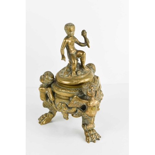 265 - A French bronze vase and cover modelled with a child holding aloft a torch to the finial raised on t... 