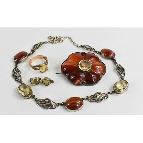 27 - A suite of Scottish agate and cairngorm set jewellery, comprising a brooch in the form of a six peta... 