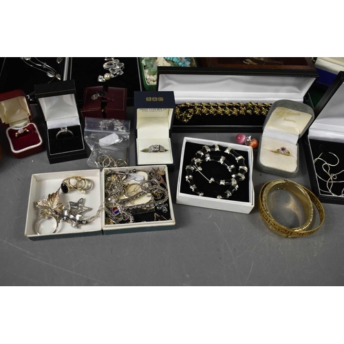 280 - A large group of silver and costume jewellery including a shell three strand necklace, three hardsto... 