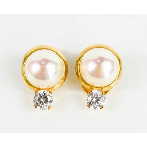 30 - A pair of 18ct gold, simulate pearl and cubic zircona clip on earrings, marked 750, 3.1g.