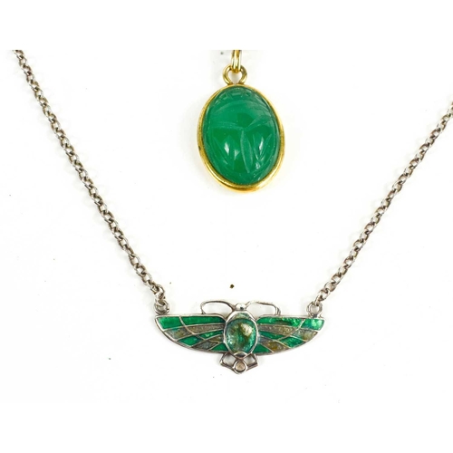 35 - Egyptian Revival interest, a three form scarab pendant of green, blue and tawny coloured stones, sus... 