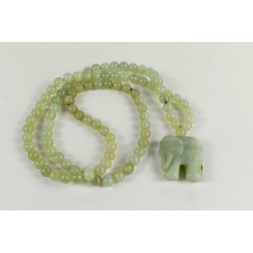 36 - A pale jade bead necklace, with elephant pendant, the necklace being approximately 76cm long, elepha... 