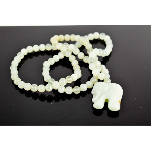 36 - A pale jade bead necklace, with elephant pendant, the necklace being approximately 76cm long, elepha... 