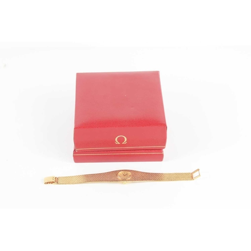 383 - A ladies 9ct gold Omega cocktail watch with an oval dial and baton hour markers, with 9ct gold Integ... 