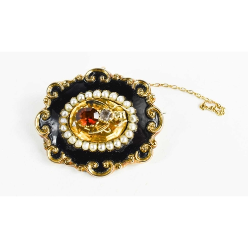 4 - A Victorian mourning brooch, the rococo scroll border with black enamel band to seed pearls surround... 