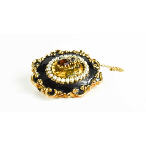 4 - A Victorian mourning brooch, the rococo scroll border with black enamel band to seed pearls surround... 