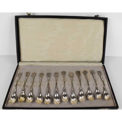 456 - A set of Alex Meijer 1928 silver coffee spoons, the handles each embossed with an individual flower ... 