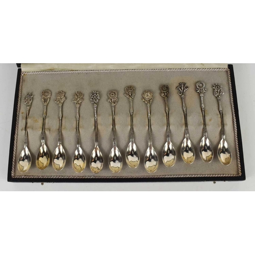 456 - A set of Alex Meijer 1928 silver coffee spoons, the handles each embossed with an individual flower ... 