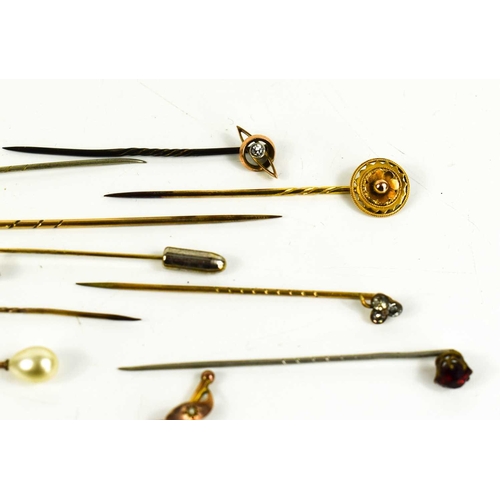 469 - A group of twelve stick stock pins including two 15ct gold Victorian examples, one set with a seed p... 