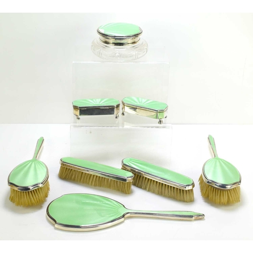 471 - A Mappin and Webb Art Deco silver and green guilloche enamel dresing table set comprising hand mirro... 