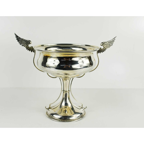 472 - A silver twin handled winged trophy, in the Art Deco style, Sheffield 1908, the wings engraved with ... 