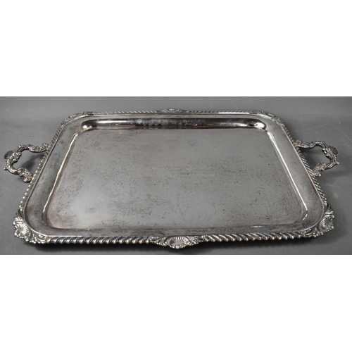 482 - An Asprey of London, solid silver twin handled tray, the deep rim with swirling gadroon and shell de... 