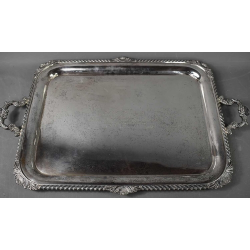 482 - An Asprey of London, solid silver twin handled tray, the deep rim with swirling gadroon and shell de... 