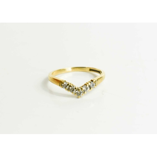 54 - A 9ct gold and diamond wishbone ring, set with five diamond brilliants, size L, 1.3g.