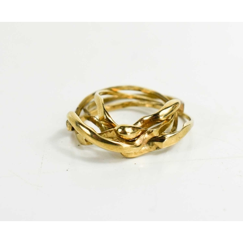 56 - A 9ct gold four piece puzzle ring, size V, 6.78g.